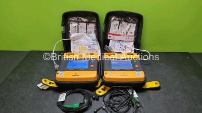 2 x Medtronic Physio Control Lifepak 1000 Defibrillators *Mfd 2007 / 2010* (Both Power Up 1 x with Slight Crack In Casing - See Photo) with 2 x 3 Lead ECG Leads, 4 x In Date Electrode Packs and 2 x Batteries *Install Before 2024 / 2028*