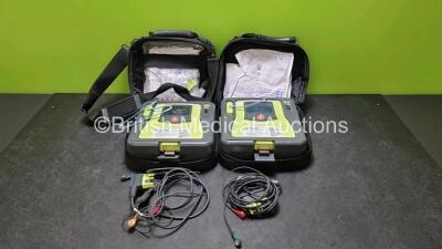 2 x Zoll AED PRO Defibrillators (Both Power Up, Both with Slight Scratching On Screen - See Photo) with 2 x 3 Lead ECG Lead, 2 x Batteries and 3 x In Date Electrode Packs