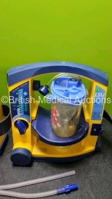 2 x LSU Laerdal Suction Units (All Power Up, 2 x with Damage to Casing - See Photo) with Hoses - 2