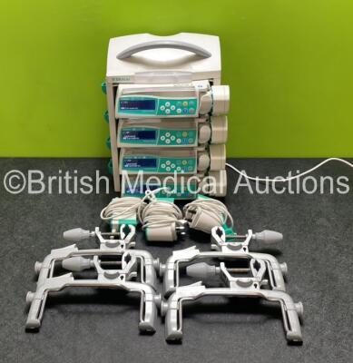 4 x B.Braun Perfusor Space Syringe Pumps (All Power Up) with 1 x B.Braun Space Station, 4 x Pole Clamps and 4 x Power Supplies (3 x Untested Power Supplies) *SN 376050 / 386838 / 386926 / 386942*