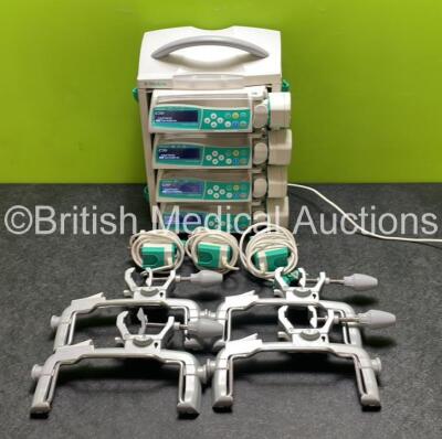 4 x B.Braun Perfusor Space Syringe Pumps (All Power Up) with 1 x B.Braun Space Station, 4 x Pole Clamps and 4 x Power Supplies (3 x Untested Power Supplies) *SN 386868 / 385920 / 386818 / 387068*