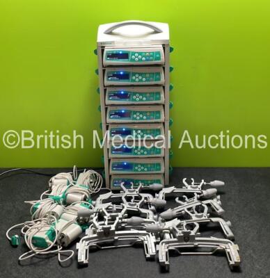 8 x B.Braun Infusomat Space Infusion Pumps (All Power Up) with 2 x B.Braun Space Stations, 8 x Pole Clamps and 8 x Power Supplies (7 x Untested Power Supplies) *SN 449036 / 449246 / 437018 / 465344 / 457891 / 458089 / 457570 / 457977*