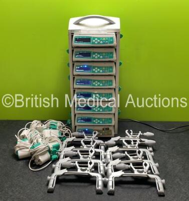 8 x B.Braun Infusomat Space Infusion Pumps (All Power Up) with 2 x B.Braun Space Stations, 8 x Pole Clamps and 8 x Power Supplies (7 x Untested Power Supplies) *SN 457590 / 457966 / 457502 / 457586 / 449455 / 457595 / 457440 / 437186*