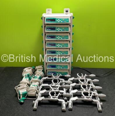 8 x B.Braun Infusomat Space Infusion Pumps (All Power Up) with 2 x B.Braun Space Stations (Missing Top / Handle) 8 x Pole Clamps and 8 x Power Supplies (7 x Untested Power Supplies) *SN 457693 / 457696 / 457646 / 457988 / 457565 / 457515 / 457584 / 457470