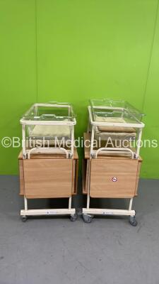 2 x Huntleigh Nesbit Evans Infant Cots with Mattresses