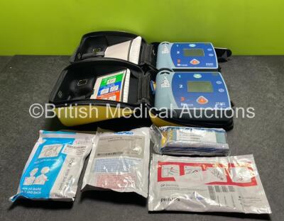 2 x Laerdal Heartstart FR2+ Defibrillators with 3 x Batteries and 3 x Electrode Packs *All Expired* in Carry Cases (Both Power Up)