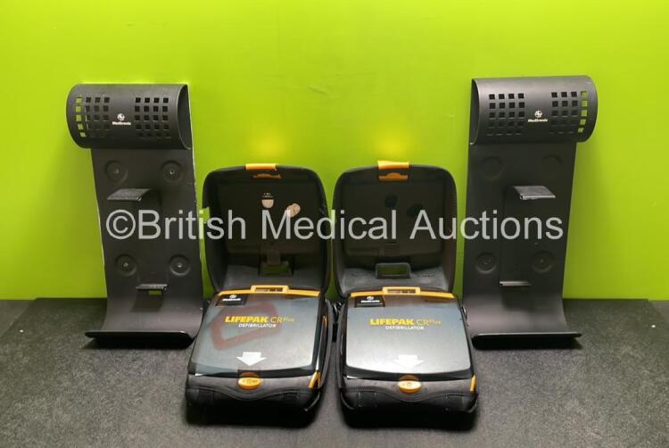 2 x Medtronic Lifepak CR Plus Defibrillators (Both Power Up) with 2 x Electrode Packs *Both Expired* in Carry Cases and 2 x Medtronic Mounting Brackets