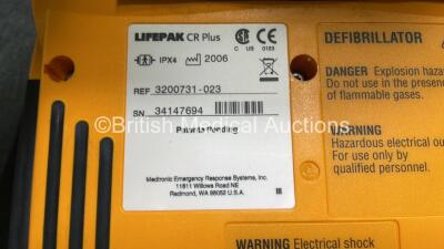 2 x Medtronic Lifepak CR Plus Defibrillators (Both Power Up) with 2 x Electrode Packs *Both Expired* in Carry Cases and 2 x Medtronic Mounting Brackets - 6