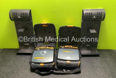 2 x Medtronic Lifepak CR Plus Defibrillators (Both Power Up) with 2 x Electrode Packs *Both Expired* in Carry Cases and 2 x Medtronic Mounting Brackets