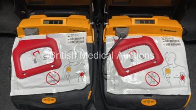 2 x Medtronic Lifepak CR Plus Defibrillators (Both Power Up) with 2 x Electrode Packs *Both Expired* in Carry Cases and 2 x Medtronic Mounting Brackets - 4