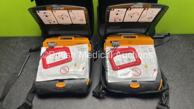 2 x Medtronic / Physio Control Lifepak CR Plus Defibrillators (Both Power Up) with 2 x Electrode Packs *Both Expired* in Carry Cases - 2