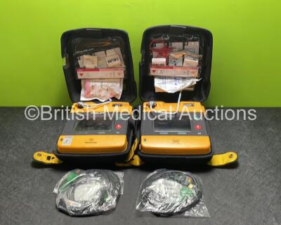 2 x Medtronic Physio Control Lifepak 1000 Defibrillators (Both Power Up with Cracks in Casing - See Photos) with 2 x 3 Lead ECG Leads, 3 x Electrode Packs (All in Date) and 2 x Batteries *Install Before 2024 / 2024*