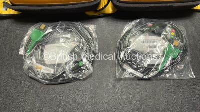 2 x Medtronic Physio Control Lifepak 1000 Defibrillators (Both Power Up with Cracks in Casing - See Photos) with 2 x 3 Lead ECG Leads, 3 x Electrode Packs (All in Date) and 2 x Batteries *Install Before 2024 / 2024* - 5