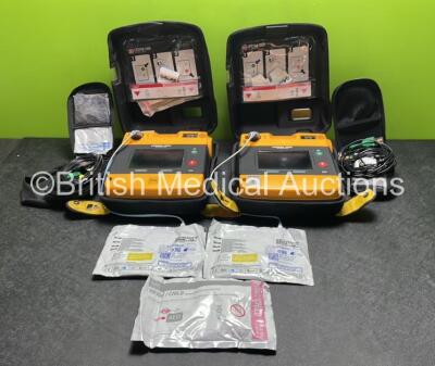 2 x Medtronic Physio Control Lifepak 1000 Defibrillators (Both Power Up with Cracks in Casing - See Photos) with 2 x 3 Lead ECG Leads, 3 x Electrode Packs (All in Date) and 2 x Batteries *Install Before 2024 / 2024*