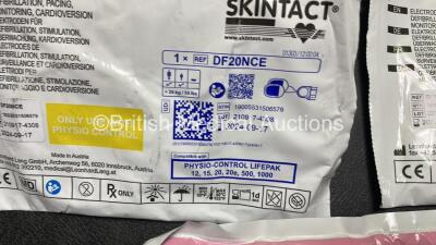 2 x Medtronic Physio Control Lifepak 1000 Defibrillators (Both Power Up with Cracks in Casing - See Photos) with 2 x 3 Lead ECG Leads, 3 x Electrode Packs (All in Date) and 2 x Batteries *Install Before 2024 / 2024* - 5