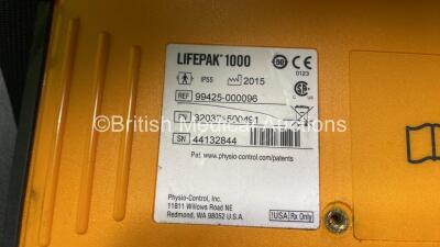 2 x Medtronic Physio Control Lifepak 1000 Defibrillators (Both Power Up with Cracks in Casing - See Photos) with 2 x 3 Lead ECG Leads, 3 x Electrode Packs (All in Date) and 2 x Batteries *Install Before 2024 / 2024* - 11