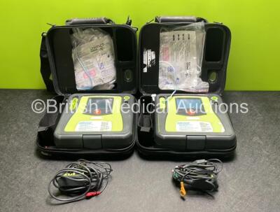 2 x Zoll AED PRO Defibrillators (Both Power Up) with 2 x 3 Lead ECG Leads, 2 x Batteries and 4 x Electrode Packs (3 x in Date, 1 x Expired)