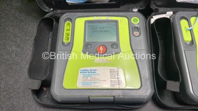 2 x Zoll AED PRO Defibrillators (Both Power Up) with 2 x 3 Lead ECG Leads, 2 x Batteries and 4 x Electrode Packs (3 x in Date, 1 x Expired) - 2