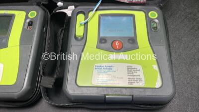 2 x Zoll AED PRO Defibrillators (Both Power Up) with 2 x 3 Lead ECG Leads, 2 x Batteries and 4 x Electrode Packs (3 x in Date, 1 x Expired) - 3