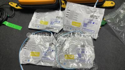 2 x Medtronic Physio Control Lifepak 1000 Defibrillators (Both Power Up with Cracks in Casing - See Photos) with 2 x 3 Lead ECG Leads, 4 x Electrode Packs (All in Date) and 2 x Batteries *Install Before 2022 / 2025* - 7