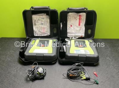 2 x Zoll AED PRO Defibrillators (Both Power Up) with 2 x 3 Lead ECG Leads, 2 x Batteries and 4 x Electrode Packs (3 x in Date, 1 x Expired)