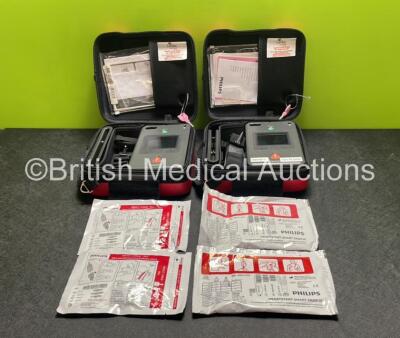 2 x Philips Heartstart FR3 Defibrillators (Both Power Up) In Carry Cases with 4 x Electrode Packs (All in Date) and 2 x Batteries (Install Before 2028 / 2027) *SN C18B-00119 / C18B-00083*