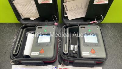 2 x Philips Heartstart FR3 Defibrillators (Both Power Up) In Carry Cases with 4 x Electrode Packs (All in Date) and 2 x Batteries (Install Before 2028 / 2028) *SN C18B-00101 / C18B-00113* - 2