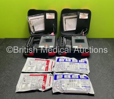 2 x Philips Heartstart FR3 Defibrillators (Both Power Up) In Carry Cases with 4 x Electrode Packs (2 in Date, 2 Expired) and 2 x Batteries (Install Before 2028 / 2028) *SN C18B-00285 / C18B-00084*