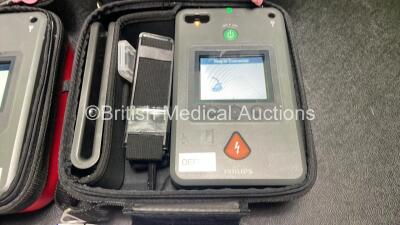 2 x Philips Heartstart FR3 Defibrillators (Both Power Up) In Carry Cases with 4 x Electrode Packs (2 in Date, 2 Expired) and 2 x Batteries (Install Before 2028 / 2028) *SN C18B-00285 / C18B-00084* - 4