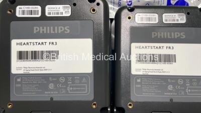 2 x Philips Heartstart FR3 Defibrillators (Both Power Up) In Carry Cases with 4 x Electrode Packs (2 in Date, 2 Expired) and 2 x Batteries (Install Before 2028 / 2028) *SN C18B-00285 / C18B-00084* - 9