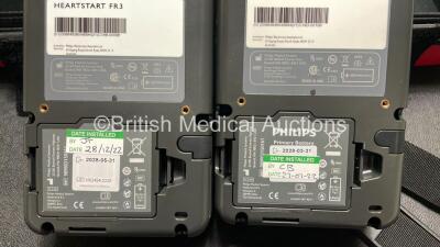 2 x Philips Heartstart FR3 Defibrillators (Both Power Up) In Carry Cases with 5 x Electrode Packs (4 in Date, 1 Expired) and 2 x Batteries (Install Before 2028 / 2028) *SN C18B-00096 / C19D-00199* - 9