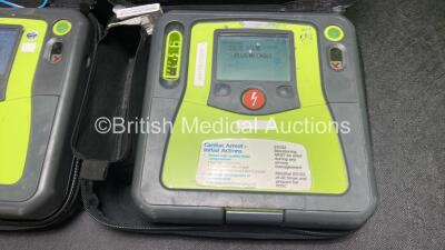 2 x Zoll AED PRO Defibrillators (Both Power Up) with 2 x 3 Lead ECG Leads, 2 x Batteries and 4 x Electrode Packs (2 x in Date, 2 x Expired) - 2