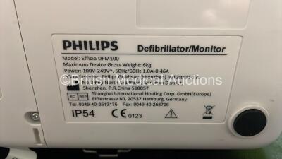 2 x Philips Efficia DFM100 Defibrillator *Mfd 2018 / 2018* with ECG and Printer Options, 2 x Batteries, 2 x Paddle Leads and 1 x 3 Lead ECG Lead (Both Power Up) *SN NA / CN32618885* - 11