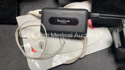 2 x Philips Heartstart FR3 Defibrillators (Both Power Up) In Carry Cases with 4 x Batteries (Install Before NA / 2023 / 2022 / 2023) and Laerdal ShockLink Box - 6