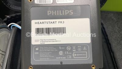 2 x Philips Heartstart FR3 Defibrillators (Both Power Up) In Carry Cases with 3 x Electrode Packs (All in Date) and 4 x Batteries (Install Before 2028 / 2028 / 2027 / 2025) - 10