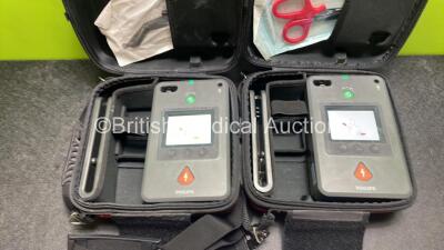 2 x Philips Heartstart FR3 Defibrillators (Both Power Up) In Carry Cases with 2 x Electrode Packs (Both in Date) and 2 x Batteries (Install Before 2028 / 2025) - 2