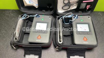 2 x Philips Heartstart FR3 Defibrillators (Both Power Up) In Carry Cases with 3 x Electrode Packs (All in Date) and 4 x Batteries (Install Before 2022 / 2022 / 2022 / 2025) - 2