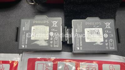 2 x Philips Heartstart FR3 Defibrillators (Both Power Up) In Carry Cases with 3 x Electrode Packs (All in Date) and 4 x Batteries (Install Before 2022 / 2022 / 2022 / 2025) - 5