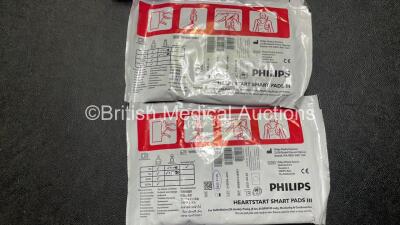 2 x Philips Heartstart FR3 Defibrillators (Both Power Up) In Carry Cases with 2 x Electrode Packs (Both in Date) and 4 x Batteries (Install Before 2028 / 2026 / 2026 / 2023) - 6