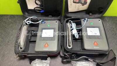 2 x Philips Heartstart FR3 Defibrillators (Both Power Up) In Carry Cases with 4 x Electrode Packs (All in Date) and 4 x Batteries (Install Before 2028 / 2028 / 2025 / 2025) - 2