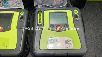 2 x Zoll AED PRO Defibrillators (Both Power Up) with 2 x 3 Lead ECG Leads, 2 x Batteries and 4 x Electrode Packs (2 x in Date, 2 x Expired) - 3