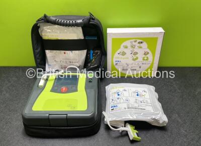 Zoll AED PRO Defibrillator with 2 x Electrode Pads *Both in Date* in Carry Case (Powers Up with Slight Damage to Screen Casing - See Photos)