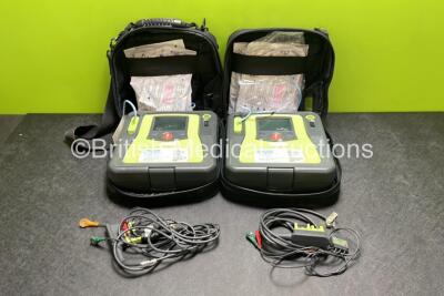 2 x Zoll AED PRO Defibrillators (Both Power Up) with 2 x 3 Lead ECG Leads, 2 x Batteries and 4 x Electrode Packs (All in Date)