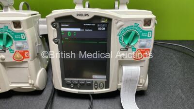 2 x Philips Heartstart MRx Defibrillators / Monitors Including ECG, and Printer Options (Both Power Up) with 2 x Philips M3725A Test Loads, 2 x Paddle Leads and 2 x Philips M3539A Modules - 2