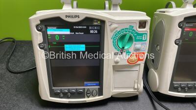 2 x Philips Heartstart MRx Defibrillators / Monitors Including ECG, and Printer Options (Both Power Up) with 2 x Philips M3725A Test Loads, 2 x Paddle Leads and 2 x Philips M3539A Modules - 3