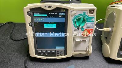 2 x Philips Heartstart MRx Defibrillators / Monitors Including ECG, and Printer Options (Both Power Up) with 1 x 3 Lead ECG Lead, 1 x Philips M3725A Test Load, 2 x Paddle Leads and 2 x Philips M3539A Modules - 3