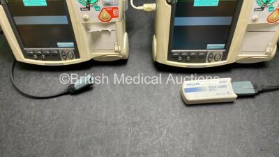 2 x Philips Heartstart MRx Defibrillators / Monitors Including ECG, and Printer Options (Both Power Up) with 1 x 3 Lead ECG Lead, 1 x Philips M3725A Test Load, 2 x Paddle Leads and 2 x Philips M3539A Modules - 4