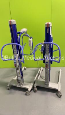 2 x Arjo MaxiMove Electric Patient Hoists with 1 x Battery and 2 x Controllers (Both Power Up) *S/N KMC-13025*