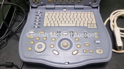 GE Logiq Book XP Portable Ultrasound Scanner Ref 5197791 *SN 7169QWX2* **HDD Removed** (Unable to Test Due to Damaged Power Supply) with GE 8L-RS Ultrasound Transducer / Probe (Untested) - 2