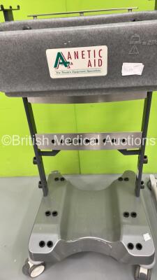 1 x Arjo Maxi-Twin Electric Patient Hoist with Battery and Controller (Powers Up), 1 x Marsden Wheelchair Weighing Scales and 1 x Anetic Aid Accessories Trolley - 2